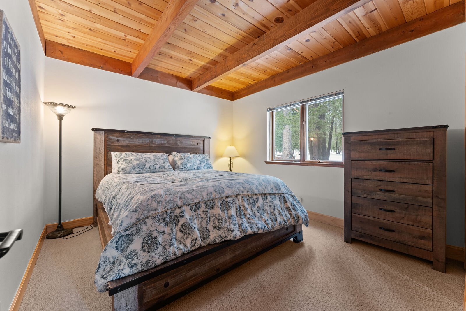 Bedroom with vaulted wood ceiling