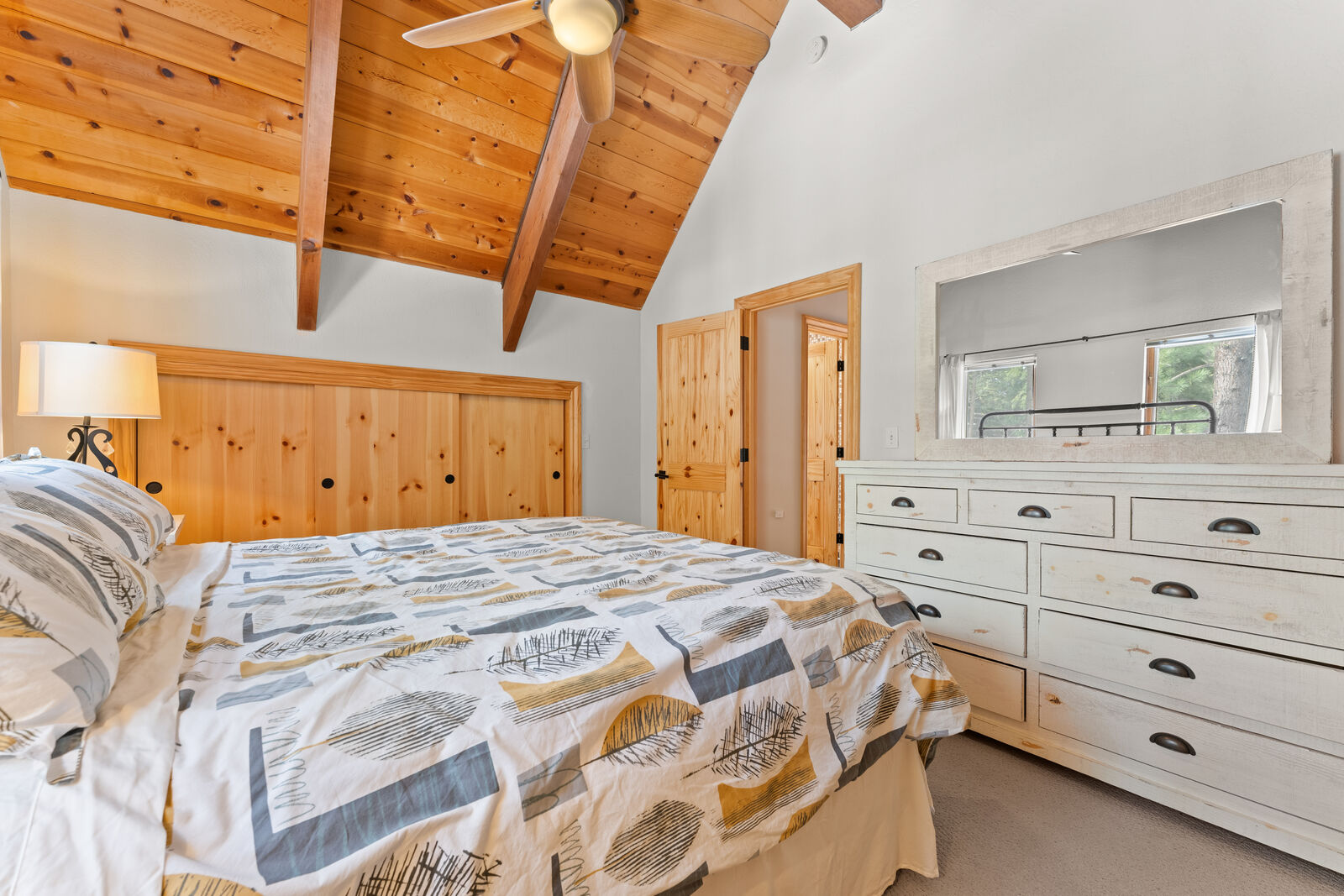 Bedroom with dresser and mirror